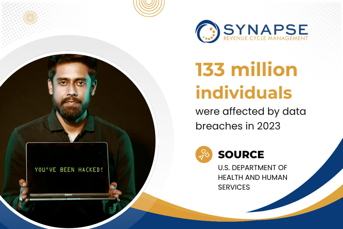 The Critical Importance of Data Security in Medical Billing A man with a beard wearing a black long-sleeve and holding a laptop.